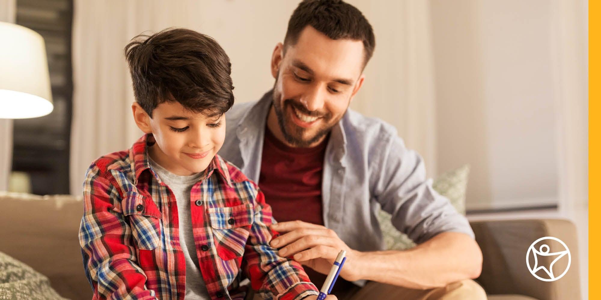 Dad and middle school boy at laptop